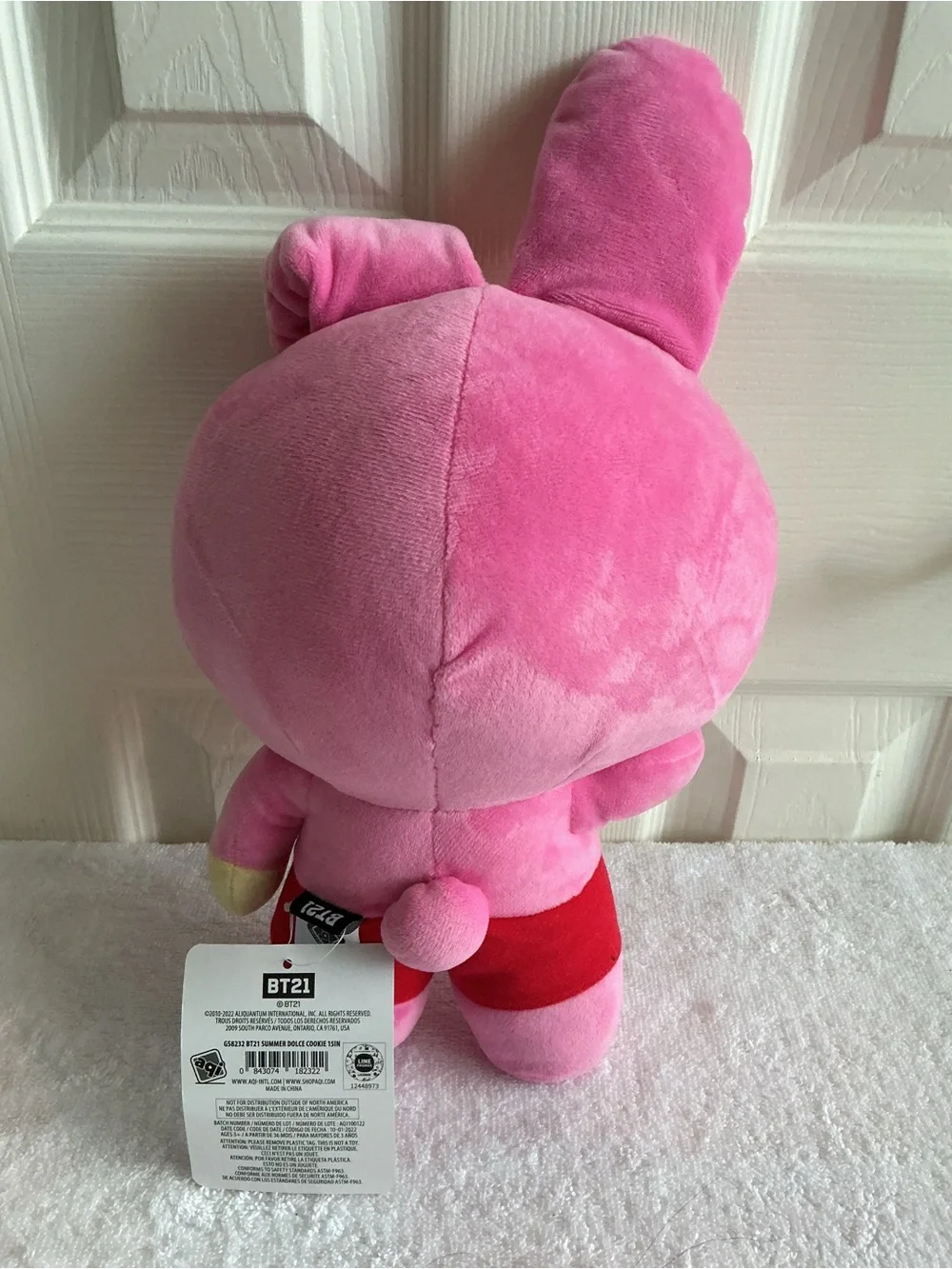 Bright Pink Plush Bunny Character Toy with Red Shorts